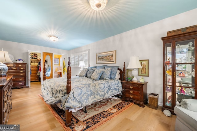 1138 Berkeley Rd, Avondale Estates, GA 30002 - bedroom featuring light wood-type flooring, a spacious closet, and a closet