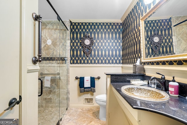 1138 Berkeley Rd, Avondale Estates, GA 30002 - bathroom featuring toilet, vanity, a shower stall, crown molding, and tile patterned floors