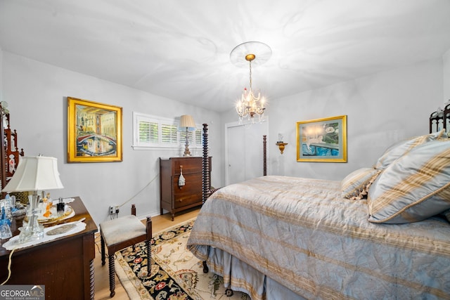 1138 Berkeley Rd, Avondale Estates, GA 30002 - bedroom with light wood-type flooring and a chandelier