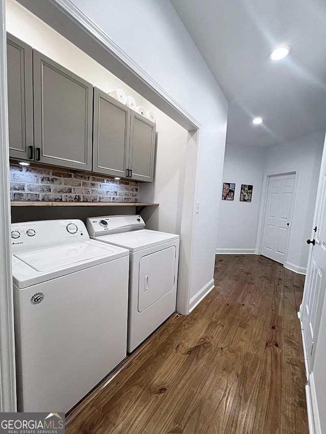 128 Golden Hills Dr, Woodstock, GA 30189 - laundry area with cabinet space, washer and clothes dryer, dark wood-style flooring, recessed lighting, and baseboards