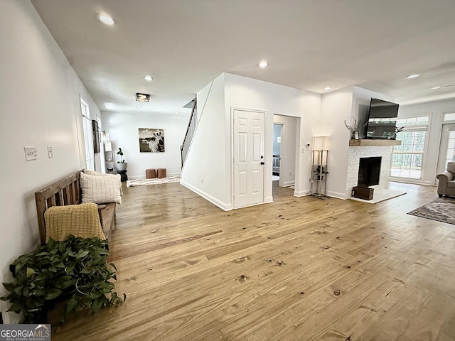 128 Golden Hills Dr, Woodstock, GA 30189 - living area with wood finished floors, a fireplace, recessed lighting, and baseboards