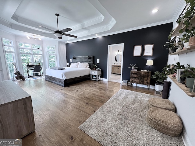 128 Golden Hills Dr, Woodstock, GA 30189 - bedroom featuring wood finished floors, crown molding, baseboards, ensuite bathroom, and a raised ceiling