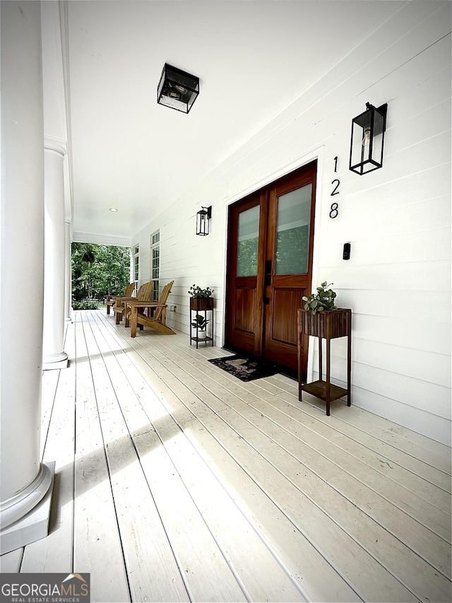 128 Golden Hills Dr, Woodstock, GA 30189 - wooden porch with french doors