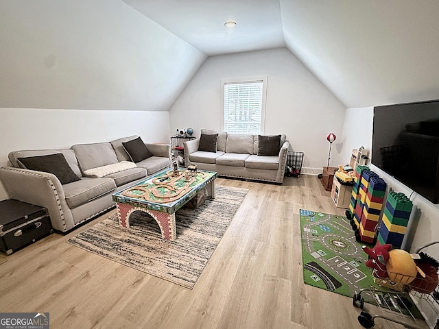 128 Golden Hills Dr, Woodstock, GA 30189 - living area featuring wood finished floors and lofted ceiling