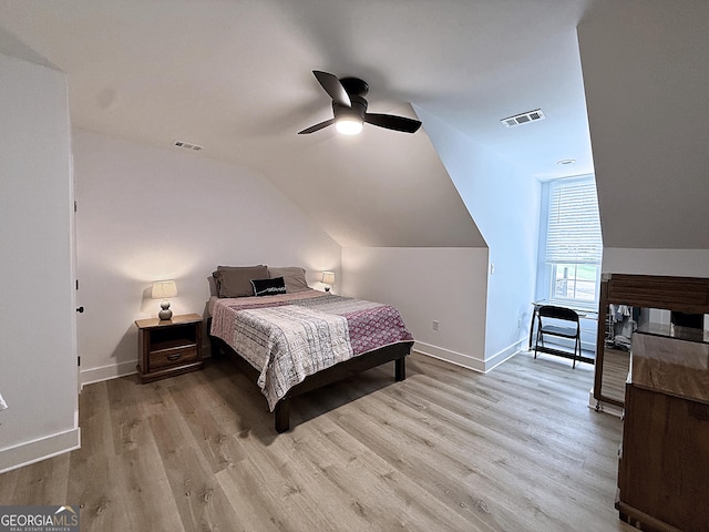 128 Golden Hills Dr, Woodstock, GA 30189 - bedroom featuring vaulted ceiling, wood finished floors, baseboards, and a ceiling fan