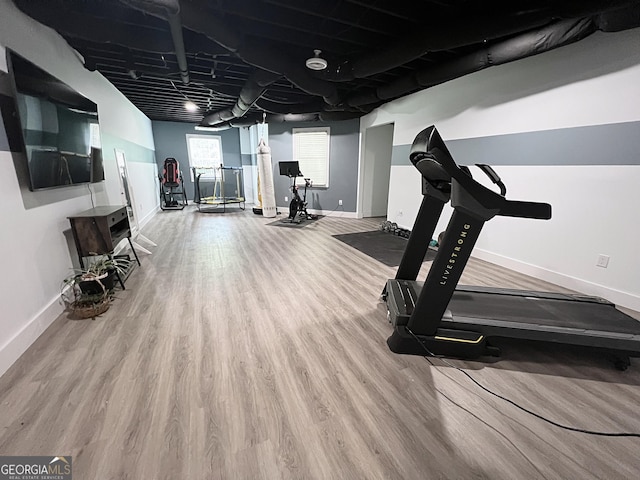 128 Golden Hills Dr, Woodstock, GA 30189 - exercise area with baseboards and wood finished floors
