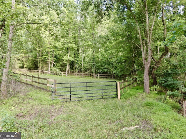 128 Golden Hills Dr, Woodstock, GA 30189 - view of yard featuring a forest view and a gate