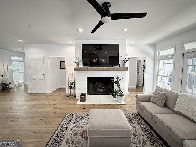 128 Golden Hills Dr, Woodstock, GA 30189 - living room featuring ceiling fan, a fireplace, wood finished floors, baseboards, and recessed lighting
