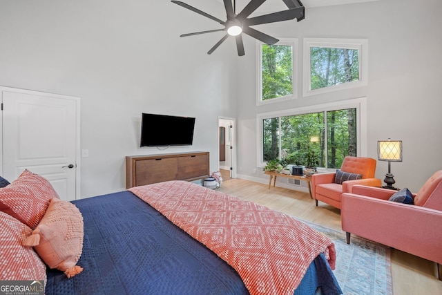 545 Matterhorn Way, Alpharetta, GA 30022 - bedroom featuring a high ceiling, light wood-type flooring, and ceiling fan