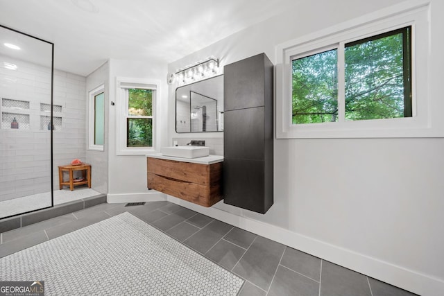 545 Matterhorn Way, Alpharetta, GA 30022 - full bathroom featuring a walk in shower, vanity, tile patterned floors, and baseboards