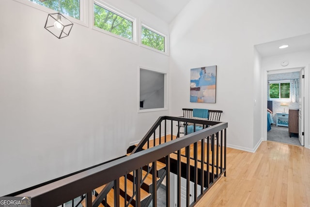 545 Matterhorn Way, Alpharetta, GA 30022 - corridor with an upstairs landing, light wood finished floors, baseboards, and recessed lighting