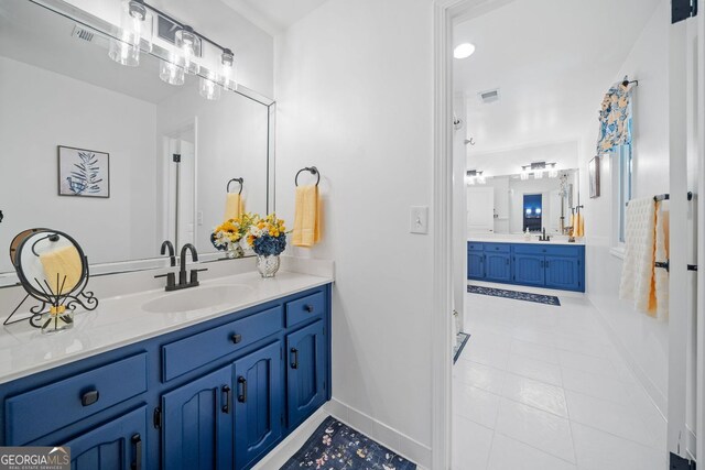 545 Matterhorn Way, Alpharetta, GA 30022 - full bathroom with vanity, baseboards, and tile patterned flooring