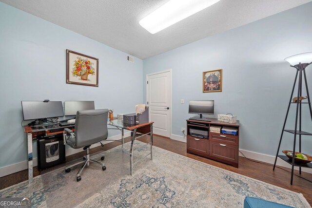 545 Matterhorn Way, Alpharetta, GA 30022 - home office featuring dark wood-style flooring and baseboards
