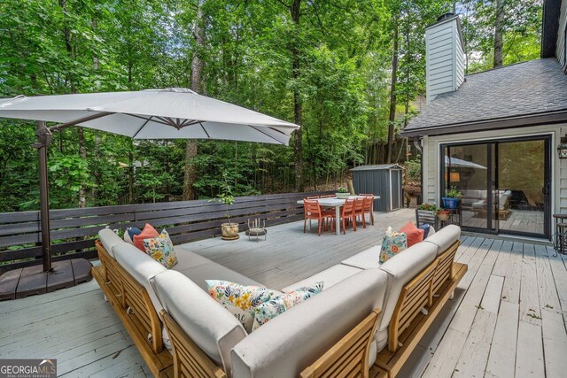 545 Matterhorn Way, Alpharetta, GA 30022 - deck featuring an outdoor living space, outdoor dining space, and view of wooded area