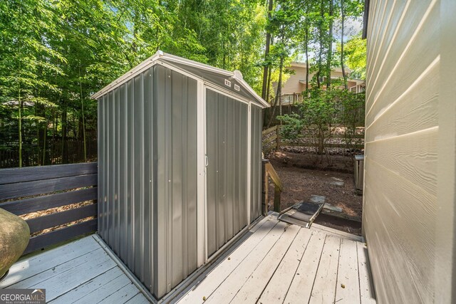 545 Matterhorn Way, Alpharetta, GA 30022 - view of shed with view of wooded area