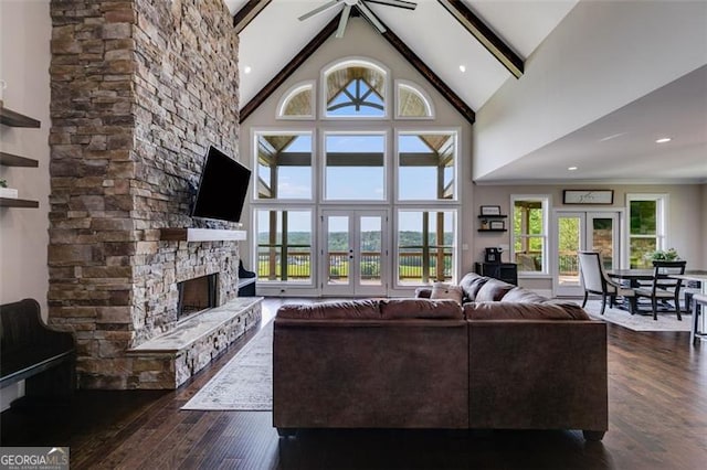1204 Springdale Rd, Rockmart, GA 30153 - living area with high vaulted ceiling, dark wood-style floors, french doors, beam ceiling, and a fireplace