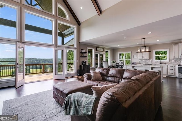 1204 Springdale Rd, Rockmart, GA 30153 - living area with high vaulted ceiling, french doors, dark wood-style flooring, recessed lighting, and beamed ceiling