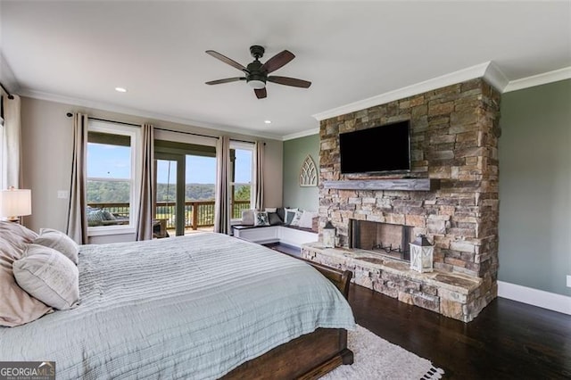1204 Springdale Rd, Rockmart, GA 30153 - bedroom with ornamental molding, access to exterior, dark wood-style floors, a stone fireplace, and ceiling fan