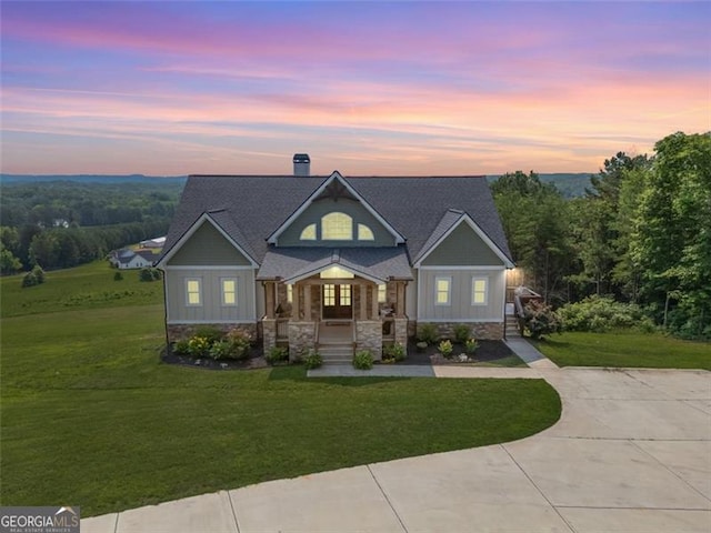 1204 Springdale Rd, Rockmart, GA 30153 - view of front of home featuring a yard, stone siding, and board and batten siding