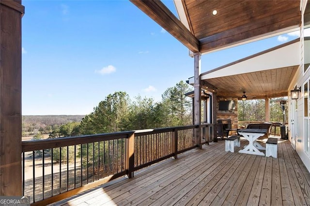 1204 Springdale Rd, Rockmart, GA 30153 - wooden terrace featuring an outdoor stone fireplace and a ceiling fan