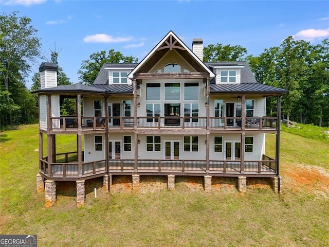 1204 Springdale Rd, Rockmart, GA 30153 - back of property featuring french doors, a chimney, a standing seam roof, a yard, and a balcony