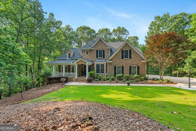 168 Eagle Pointe Dr, Dahlonega, GA 30533 - traditional home featuring a porch, a front lawn, a chimney, and stone siding
