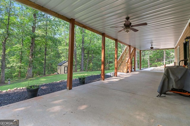 168 Eagle Pointe Dr, Dahlonega, GA 30533 - view of patio with a ceiling fan, stairs, and a storage unit