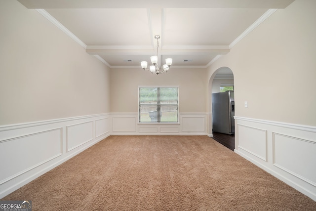 212 Jetta Cir, Mcdonough, GA 30253 - carpeted empty room with crown molding, a chandelier, coffered ceiling, arched walkways, and a decorative wall