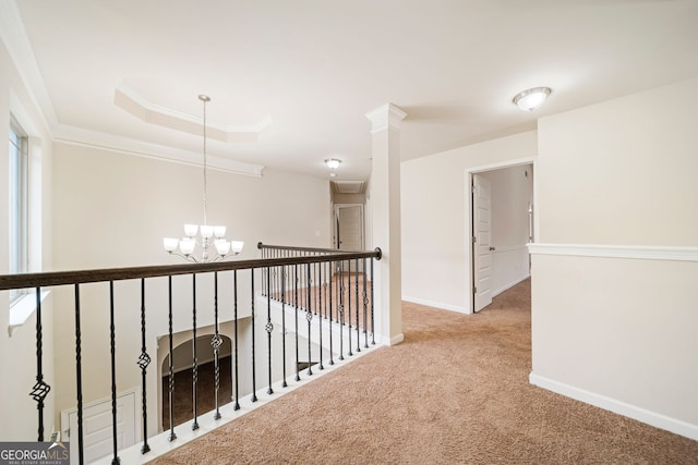 212 Jetta Cir, Mcdonough, GA 30253 - hallway with a chandelier, carpet, a tray ceiling, and crown molding