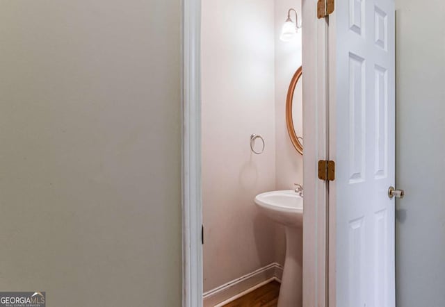 4045 Hillcrest View Ct, Suwanee, GA 30024 - bathroom featuring baseboards, wood finished floors, and a sink