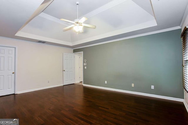 4045 Hillcrest View Ct, Suwanee, GA 30024 - unfurnished bedroom featuring a tray ceiling, wood finished floors, baseboards, ornamental molding, and a ceiling fan
