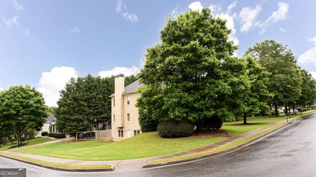 4045 Hillcrest View Ct, Suwanee, GA 30024 - view of side of property featuring a lawn and a chimney