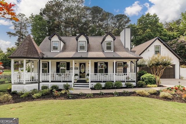 870 Rutherford Dr, Dacula, GA 30019 - view of front of property with covered porch, a garage, a front yard, and a shingled roof