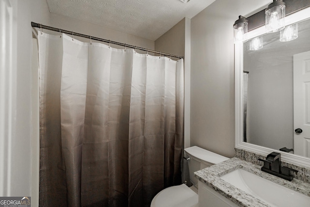 870 Rutherford Dr, Dacula, GA 30019 - full bathroom featuring vanity, a textured ceiling, and curtained shower
