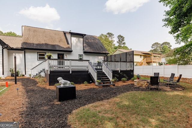 870 Rutherford Dr, Dacula, GA 30019 - rear view of house with an outdoor fire pit, roof with shingles, a deck, and stairway