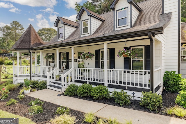 870 Rutherford Dr, Dacula, GA 30019 - cape cod-style house featuring a porch and roof with shingles