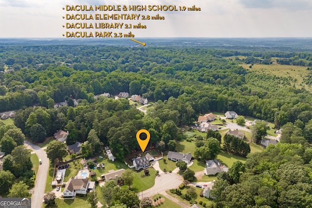 870 Rutherford Dr, Dacula, GA 30019 - aerial perspective of suburban area with a forest
