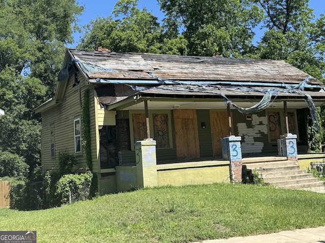 1425 3rd St, Macon, GA 31201 - bungalow-style house with a porch, a front lawn, and a shingled roof