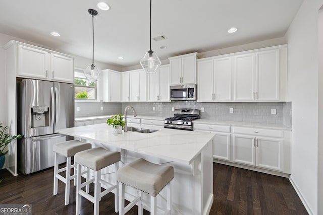1998 Lakeview Bend Way, Buford, GA 30519 - kitchen featuring appliances with stainless steel finishes, a sink, white cabinets, tasteful backsplash, and recessed lighting