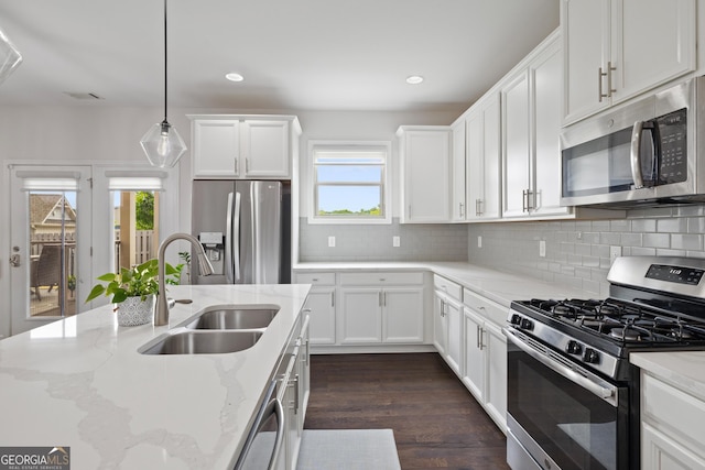 1998 Lakeview Bend Way, Buford, GA 30519 - kitchen featuring stainless steel appliances, a sink, healthy amount of natural light, white cabinetry, and recessed lighting