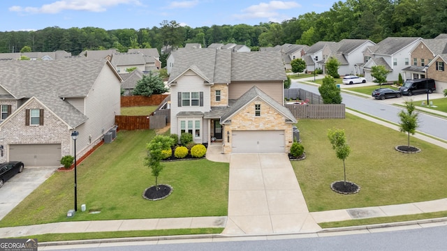 1998 Lakeview Bend Way, Buford, GA 30519 - traditional home with driveway, stone siding, a residential view, and an attached garage