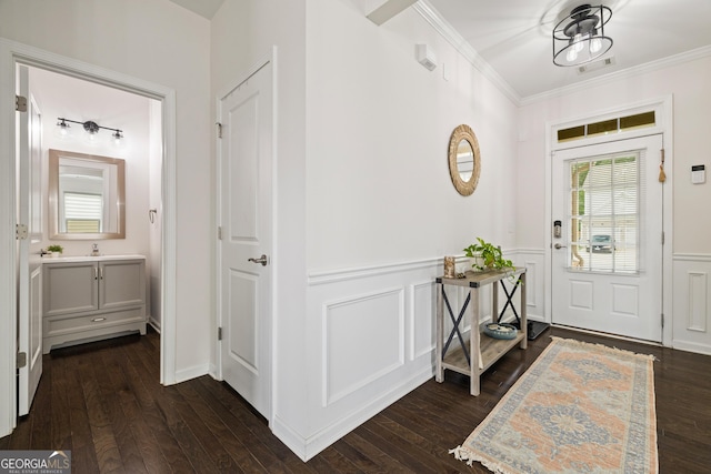 1998 Lakeview Bend Way, Buford, GA 30519 - entrance foyer featuring crown molding, a wainscoted wall, dark wood-style flooring, and a decorative wall
