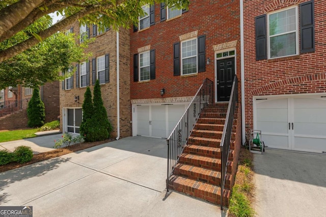 2264 Ewell Park Dr, Lawrenceville, GA 30043 - view of front facade with a garage, concrete driveway, and brick siding