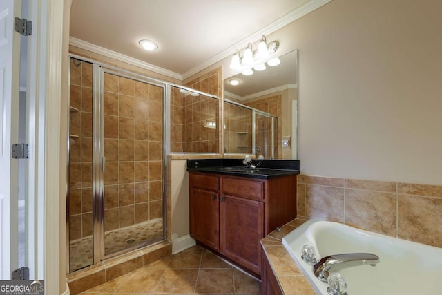 2264 Ewell Park Dr, Lawrenceville, GA 30043 - bathroom with vanity, a shower stall, a garden tub, ornamental molding, and tile patterned flooring
