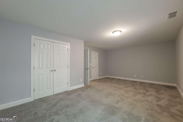 2264 Ewell Park Dr, Lawrenceville, GA 30043 - unfurnished bedroom with carpet, baseboards, and a closet