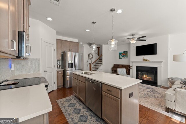61 N Auburn Landing Pl, Auburn, GA 30011 - kitchen with appliances with stainless steel finishes, open floor plan, light countertops, ceiling fan, and recessed lighting