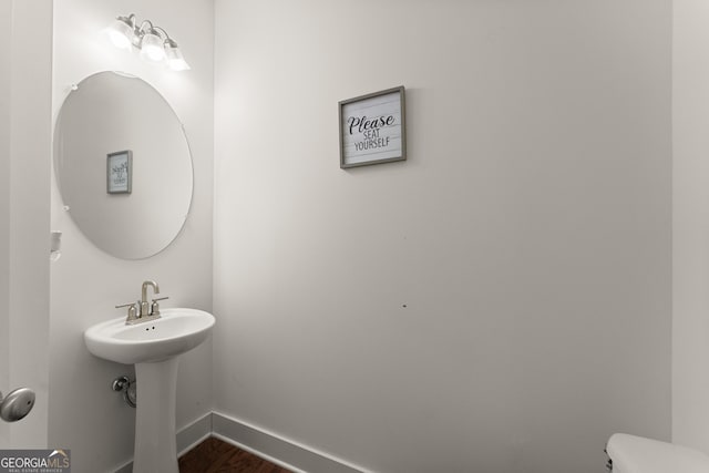 61 N Auburn Landing Pl, Auburn, GA 30011 - half bath featuring wood finished floors, baseboards, and toilet