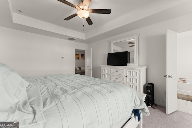 61 N Auburn Landing Pl, Auburn, GA 30011 - bedroom with a tray ceiling, light colored carpet, and a ceiling fan