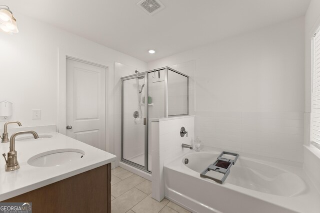 61 N Auburn Landing Pl, Auburn, GA 30011 - full bathroom featuring a garden tub, tile patterned flooring, a stall shower, double vanity, and recessed lighting
