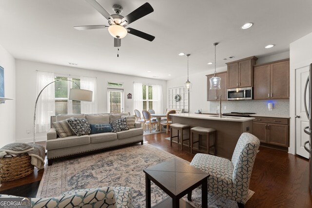 61 N Auburn Landing Pl, Auburn, GA 30011 - living area with dark wood finished floors, a ceiling fan, and recessed lighting
